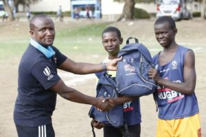 Johnbosco Muamba handing out a GIR kit